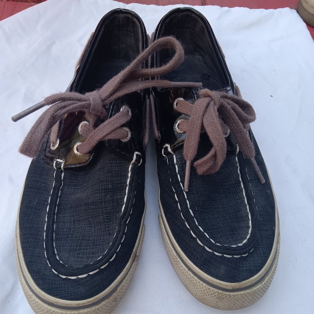 Black Sperry's with brown strings.